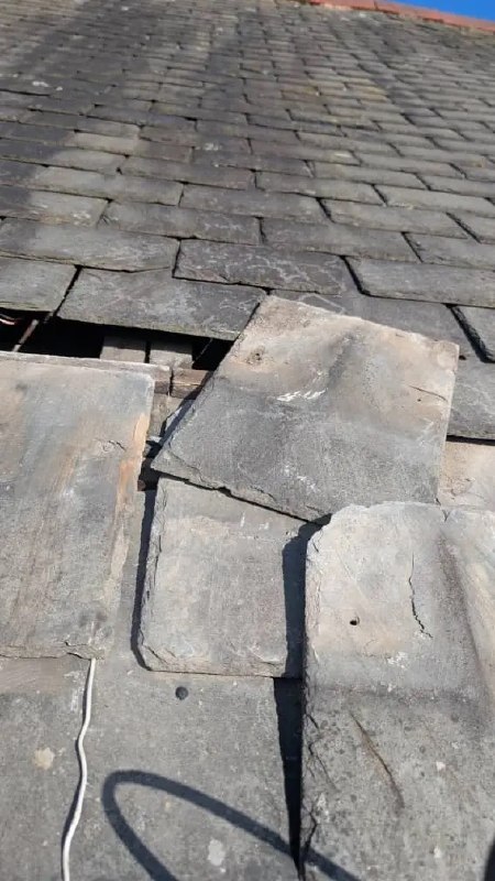 Damaged slate roof requiring repair in Newcastle upon Tyne