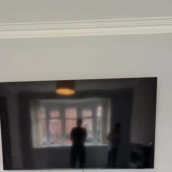 85-inch TV mounted on a living room wall in Newcastle