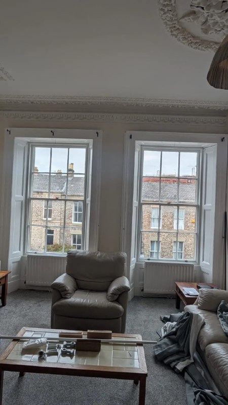 Two tall sash windows before curtain installation in a Gateshead sitting room