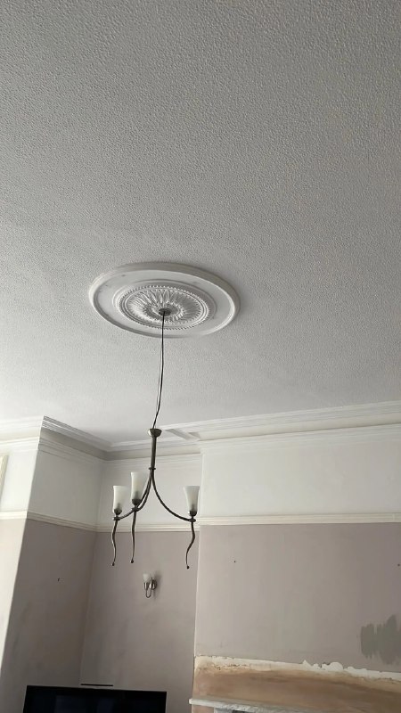 Completed decorative ceiling rose fitted around a chandelier in Newcastle