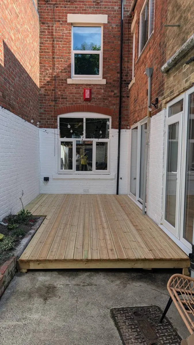 Completed timber decking in a residential courtyard