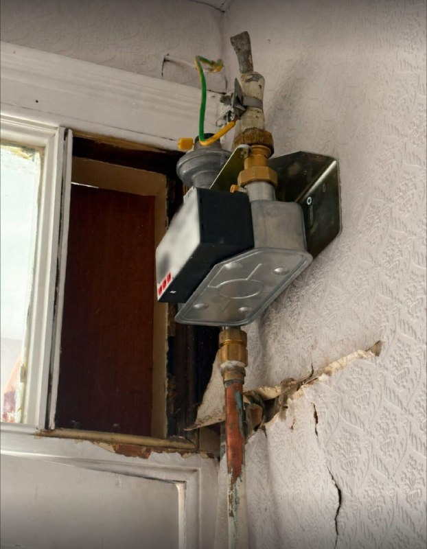 Damaged internal wall around a meter installation before repair in Jarrow