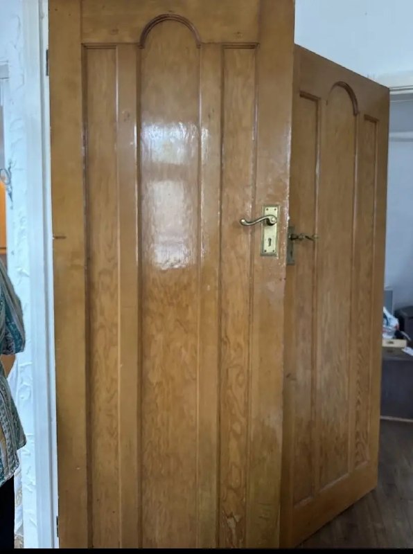 Wooden internal door with an older handle and lock in Newcastle