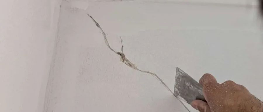 Preparing a crack in an internal wall for repair