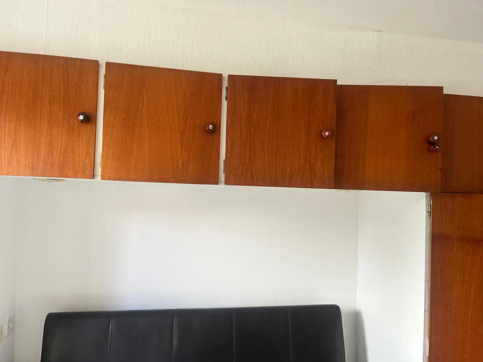 Dark fitted wardrobe before painting in Newcastle NE5