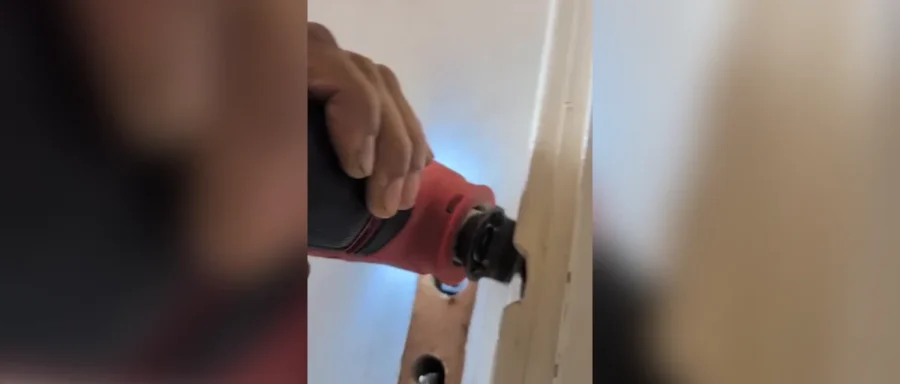 Handyman repairing a bathroom door lock during a Sunday call-out in Newcastle