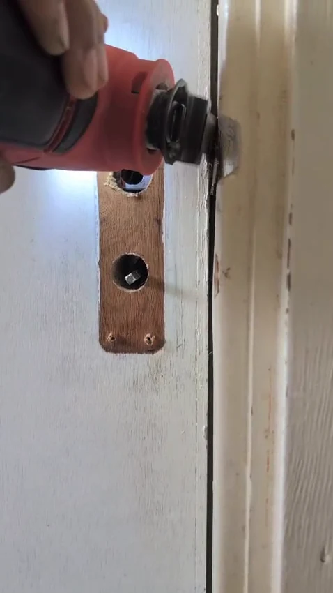 Close-up of bathroom door lock repair during a Handyman MultiFix call-out