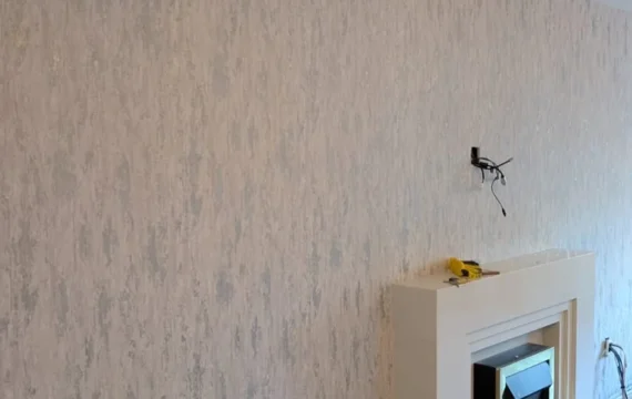 Finished textured wallpaper feature wall around fireplace in Newcastle NE13